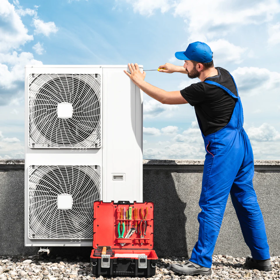 a person doing maintenance on hvac exhaust fans